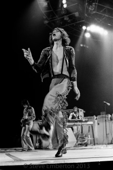 Mick Jagger strutting across the stage